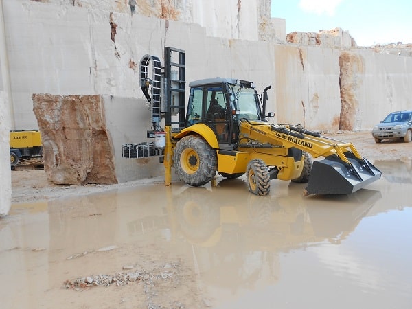 The NHC backhoe cutting marble1
