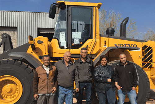 From left, George Mazraani (Contractor), Simaan el Kaii (Main Contractor), Anthony Abdelmassih (AMTRAC), Joumana Maakaron (Mercy Corps), Mohamad Saleh (MORES) gather at Zahle Waste Treatment Plant to celebrate the arrival of the Volvo L110F wheel loader.