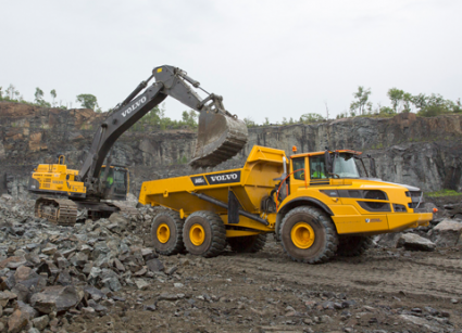 Making light of the heavy-duties is the job of two Volvo machines, working in harmony to lift and load the material for processing.