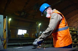 Highly Professional Worker Using Angle Grinder